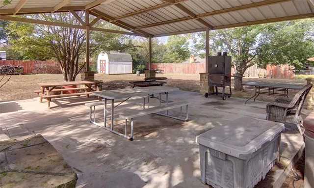 a view of a porch with furniture and garden view
