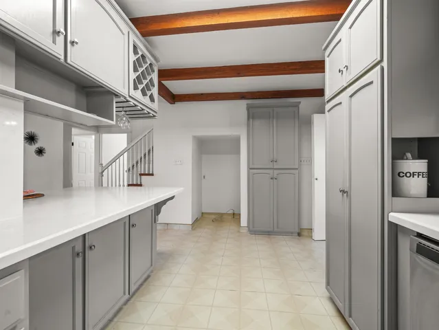 a kitchen with a sink and cabinets