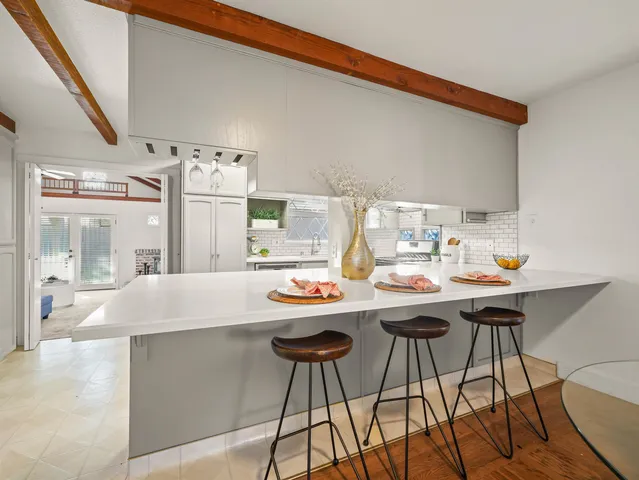 a dinning table and chairs in a kitchen