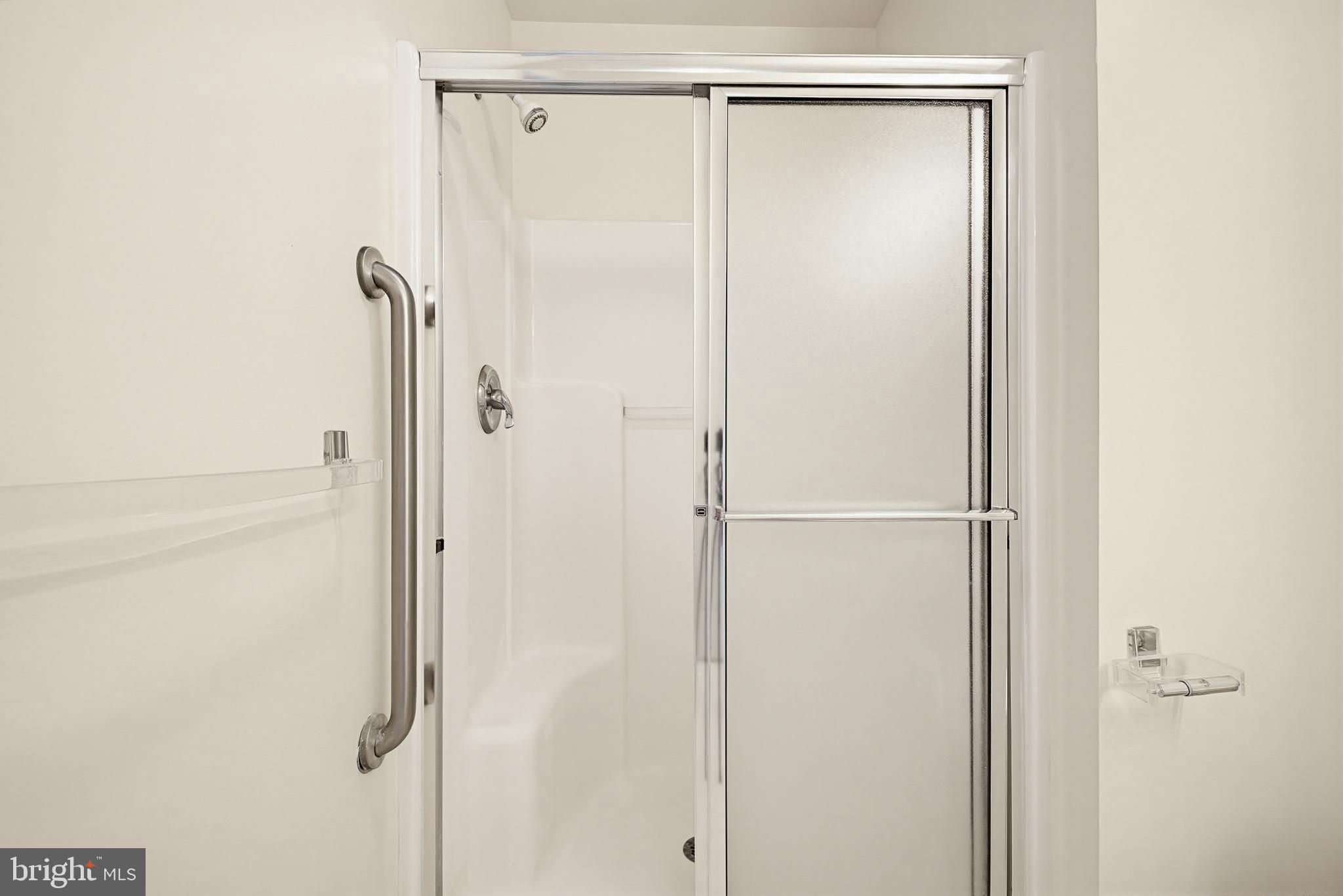1037 Kent Garden Lititz, PA 17543 - Photo 28 of 31 a bathroom with a glass shower door