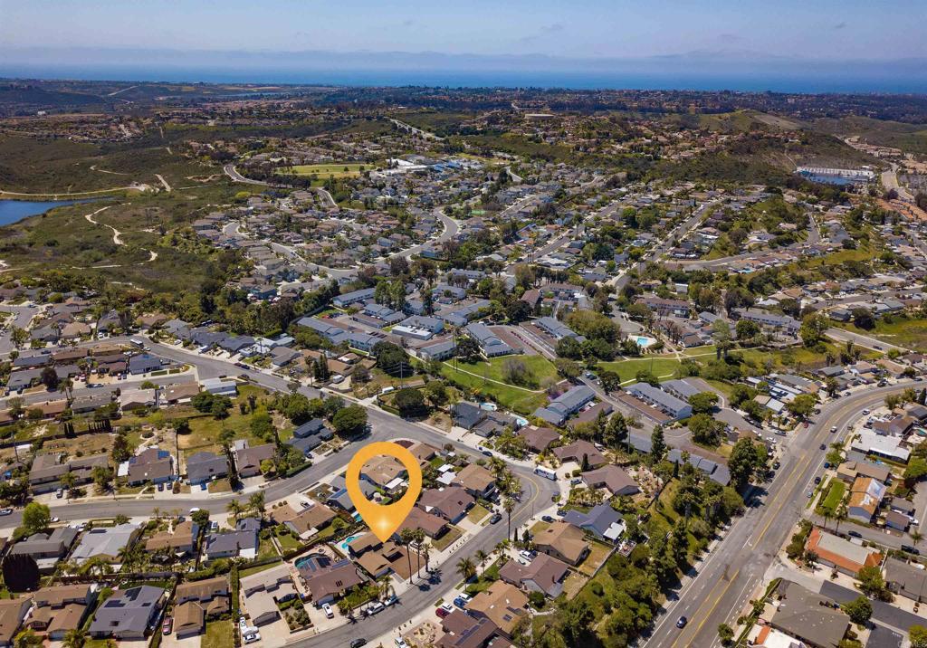 4215 Cielo Avenue Oceanside, CA 92056 - Photo 11 of 27 an aerial view of residential building with parking and yard