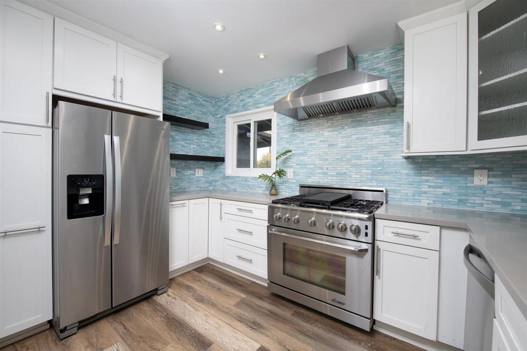 4215 Cielo Avenue Oceanside, CA 92056 - Photo 15 of 27 a kitchen with a stove refrigerator and microwave