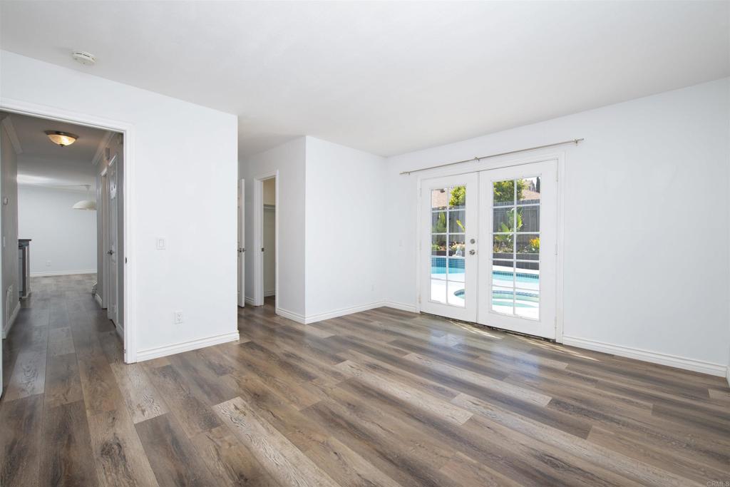 4215 Cielo Avenue Oceanside, CA 92056 - Photo 21 of 27 wooden floor in an empty room with a window