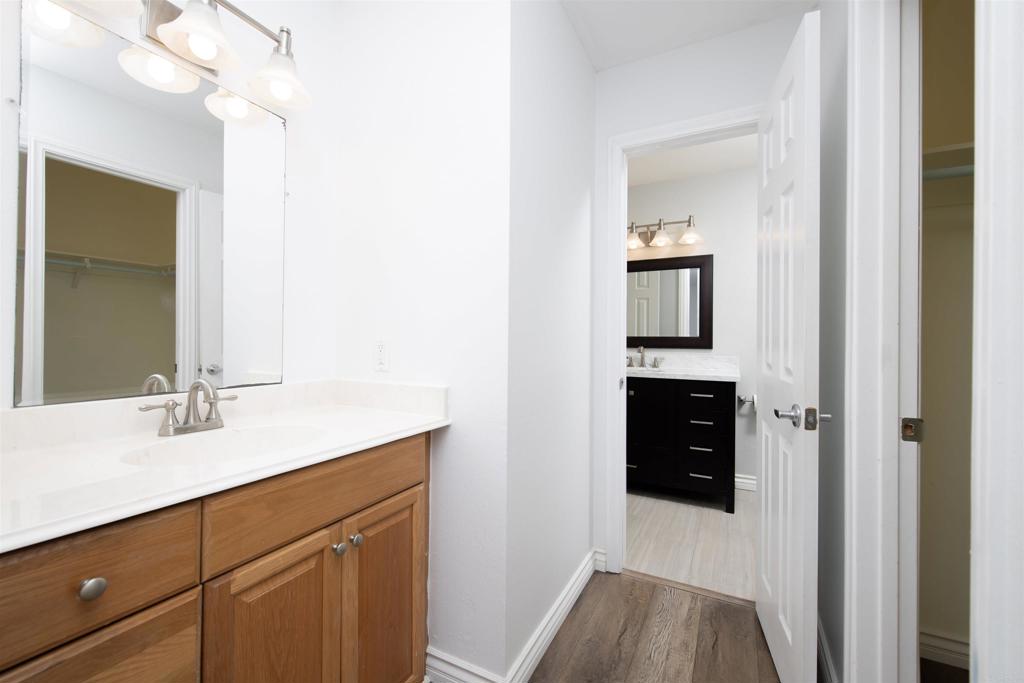 4215 Cielo Avenue Oceanside, CA 92056 - Photo 23 of 27 a en suite bathroom with a sink and a mirror