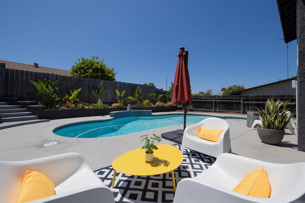 4215 Cielo Avenue Oceanside, CA 92056 - Photo 3 of 27 a view of a swimming pool with a patio and a yard