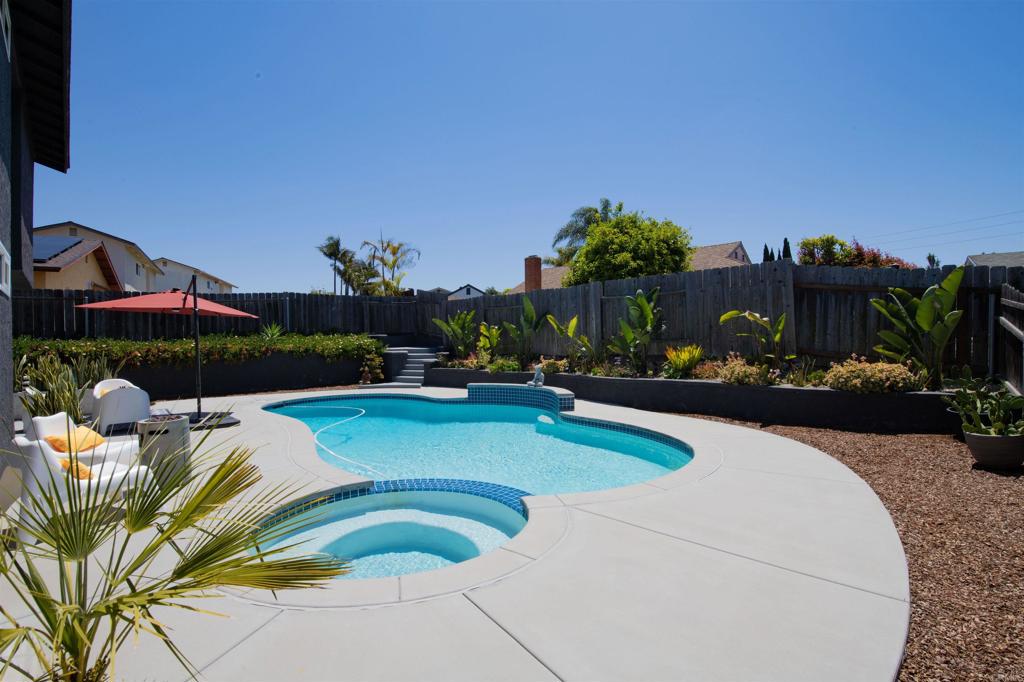 4215 Cielo Avenue Oceanside, CA 92056 - Photo 6 of 27 a view of a swimming pool with outdoor seating and plants
