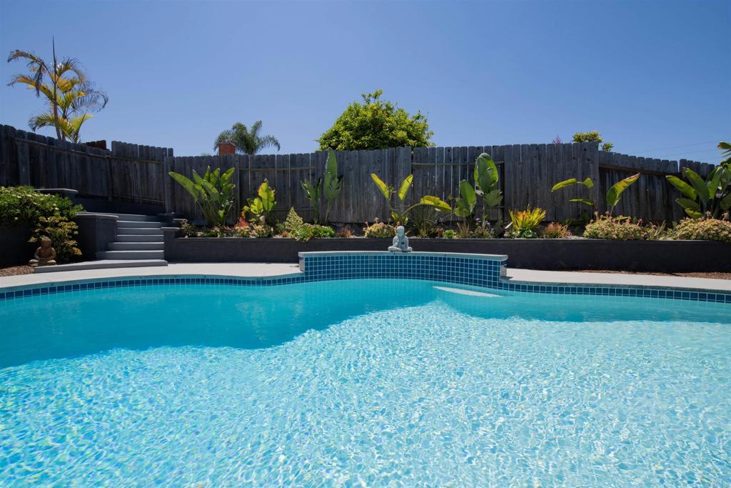 4215 Cielo Avenue Oceanside, CA 92056 - Photo 7 of 27 a front view of a house with a yard
