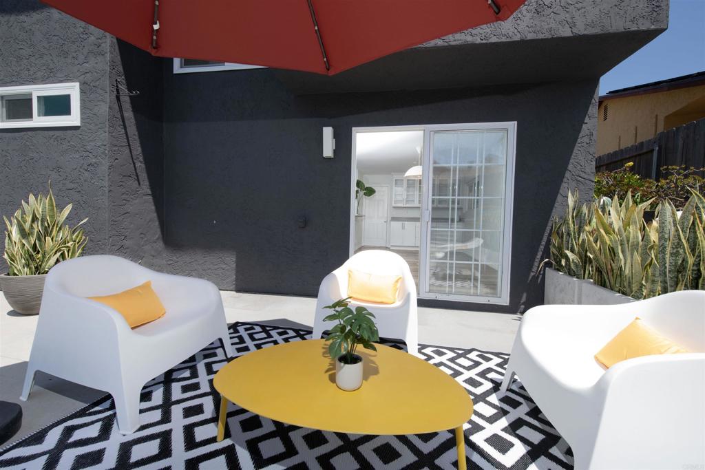 4215 Cielo Avenue Oceanside, CA 92056 - Photo 8 of 27 a view of a dining room with furniture and wooden floor