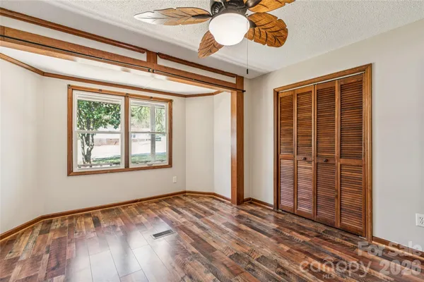 a view of an entryway with wooden floor