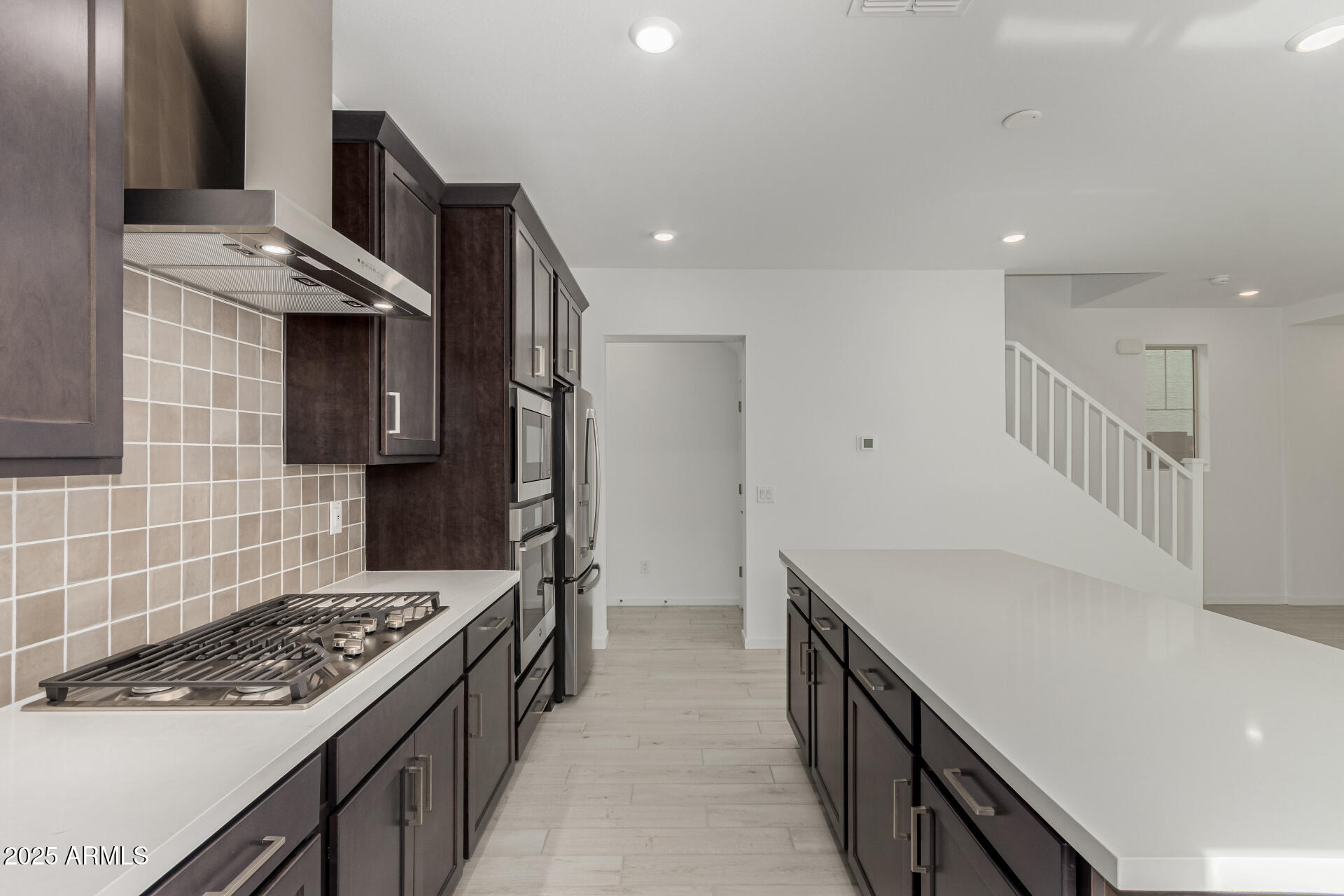 2474 West Rowel Road Phoenix, AZ 85085 - Photo 11 of 38 a kitchen with a stove and a sink