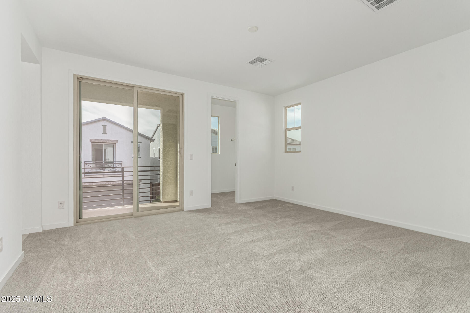 2474 West Rowel Road Phoenix, AZ 85085 - Photo 14 of 38 an empty room with windows