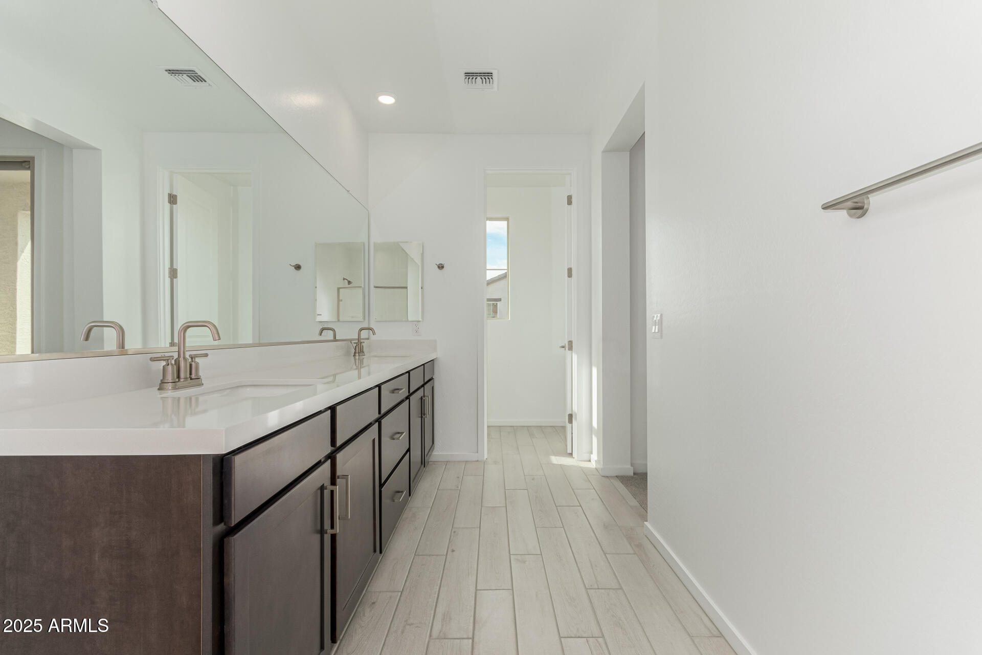 2474 West Rowel Road Phoenix, AZ 85085 - Photo 18 of 38 a bathroom with a double vanity sink and a mirror