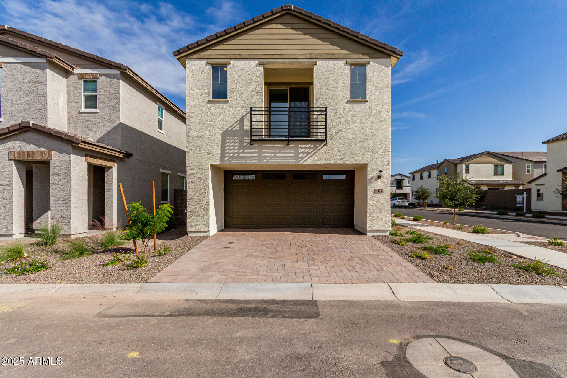 2474 West Rowel Road Phoenix, AZ 85085 - Photo 2 of 38 a front view of a house with a yard and garage