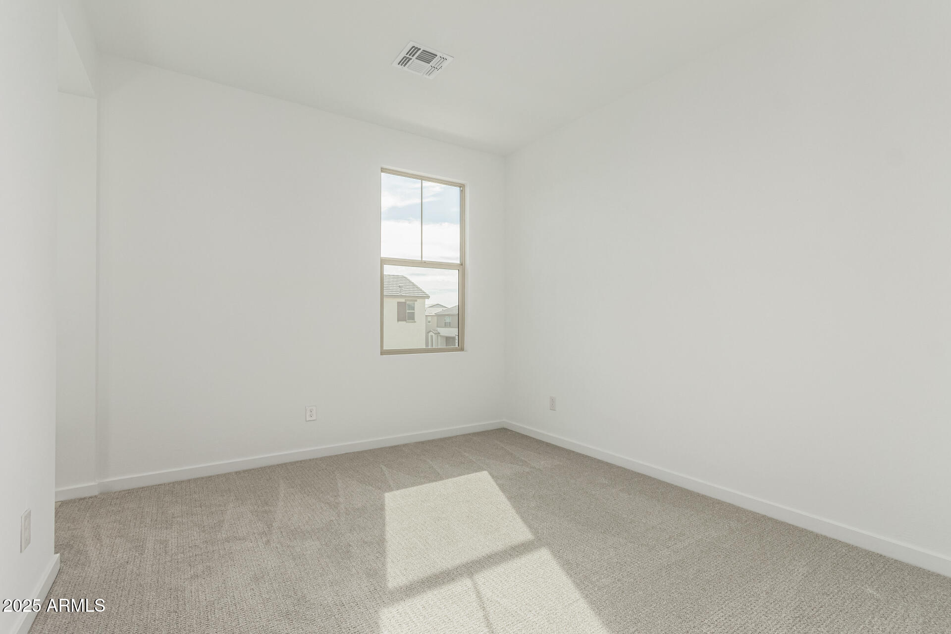 2474 West Rowel Road Phoenix, AZ 85085 - Photo 22 of 38 an empty room with windows