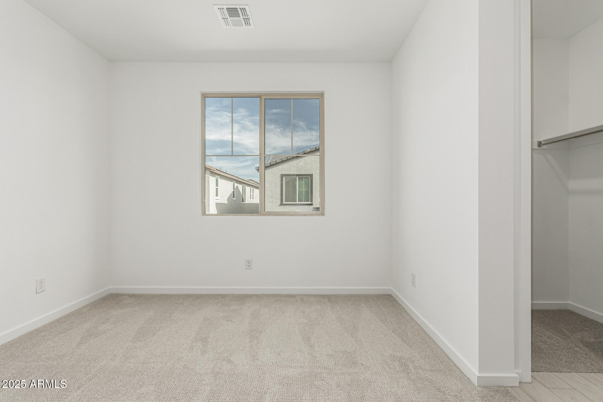 2474 West Rowel Road Phoenix, AZ 85085 - Photo 27 of 38 an empty room with a window