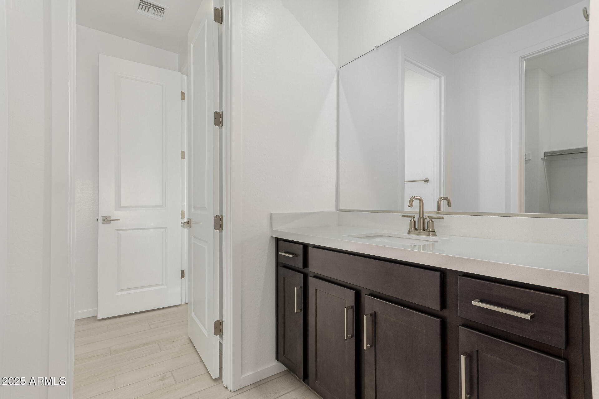 2474 West Rowel Road Phoenix, AZ 85085 - Photo 28 of 38 a bathroom with a sink and a mirror