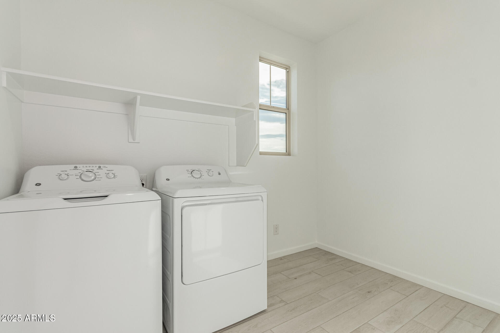 2474 West Rowel Road Phoenix, AZ 85085 - Photo 29 of 38 a utility room with dryer and washer