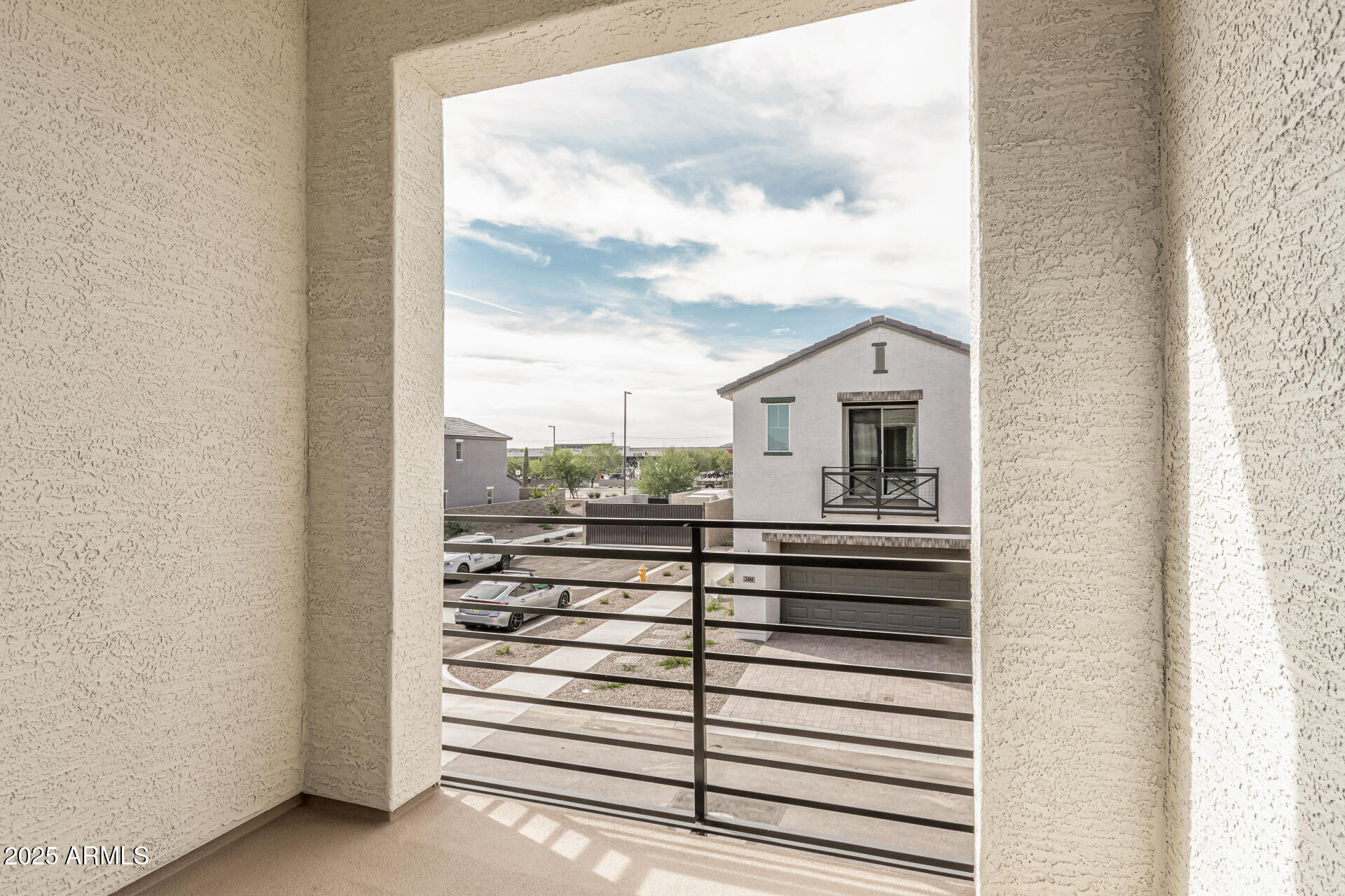 2474 West Rowel Road Phoenix, AZ 85085 - Photo 31 of 38 a view of a balcony with table and chairs
