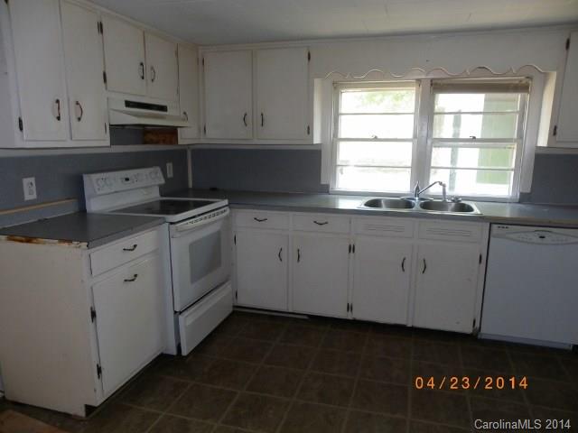 1960 Pleasant Road Fort Mill, SC 29708 - Photo 2 of 9 a kitchen with granite countertop white cabinets and a stove