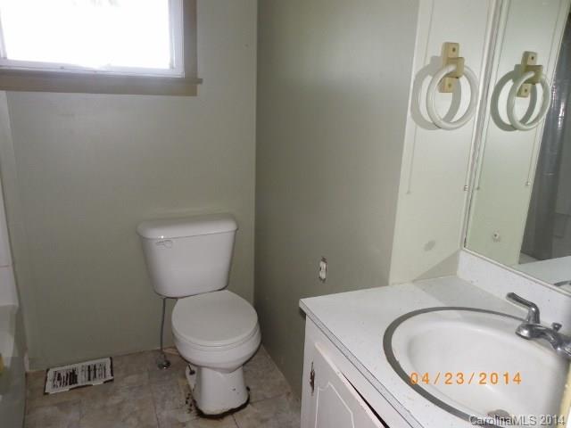 1960 Pleasant Road Fort Mill, SC 29708 - Photo 6 of 9 a bathroom with a toilet sink and a mirror
