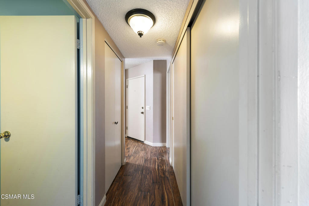 1772 Sinaloa Road, Unit 189 Simi Valley, CA 93065 - Photo 18 of 29 a view of a hallway with wooden floor and staircase