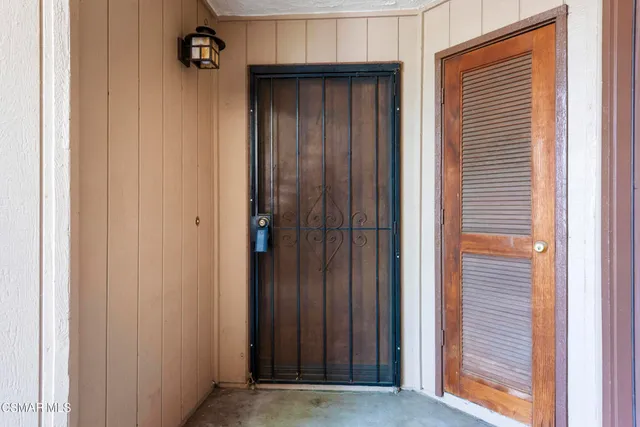 a view of a house with a wooden deck