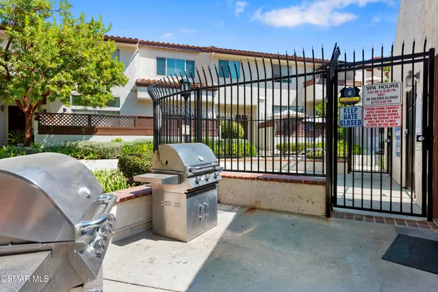 a view of a backyard with sitting area