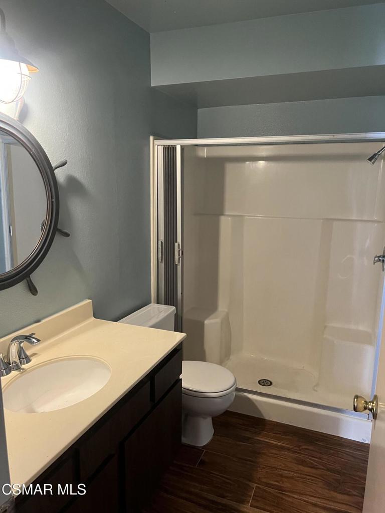 1772 Sinaloa Road, Unit 189 Simi Valley, CA 93065 - Photo 4 of 29 a bathroom with a sink a toilet and a mirror