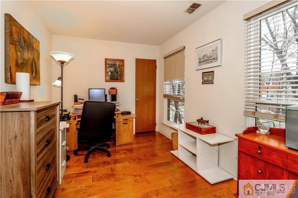 306 Maplecrest Road, Unit 306 Edison, NJ 08820 - Photo 15 of 25 a view of a workspace with furniture and a window
