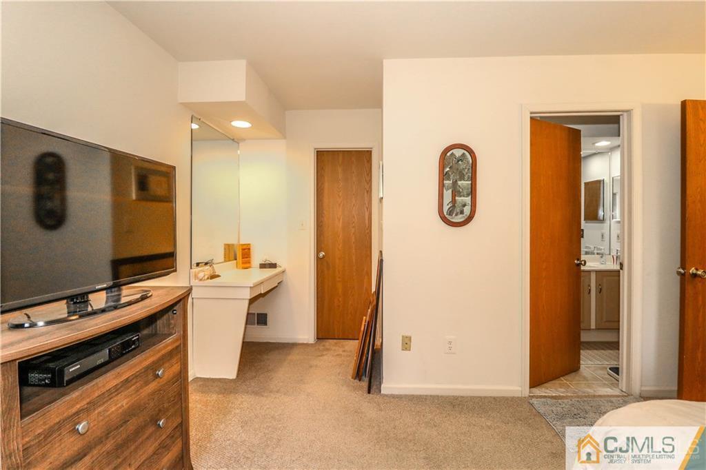 306 Maplecrest Road, Unit 306 Edison, NJ 08820 - Photo 18 of 25 a view of room with flat screen tv