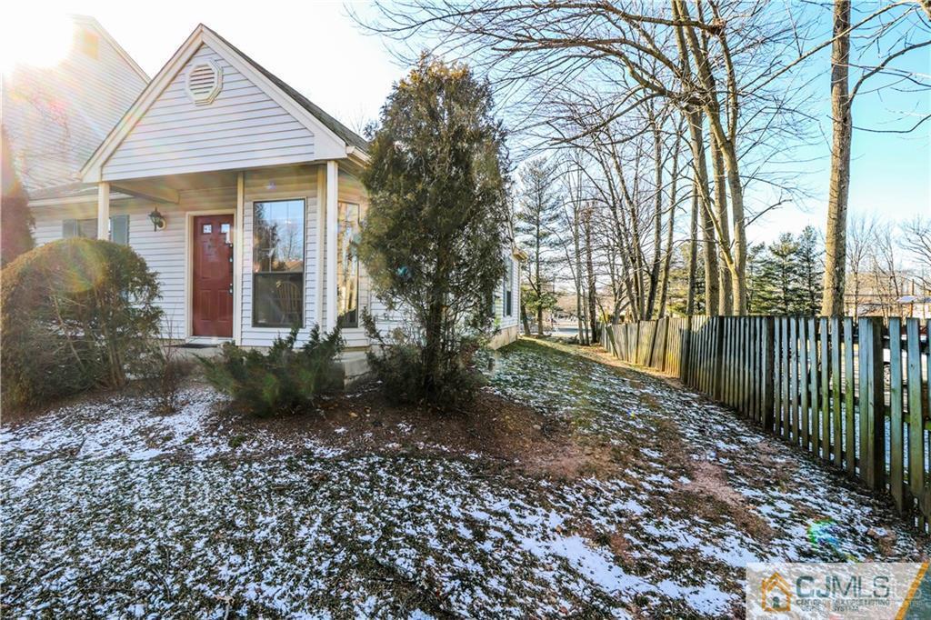 306 Maplecrest Road, Unit 306 Edison, NJ 08820 - Photo 24 of 25 a view of a house with a small yard and plants