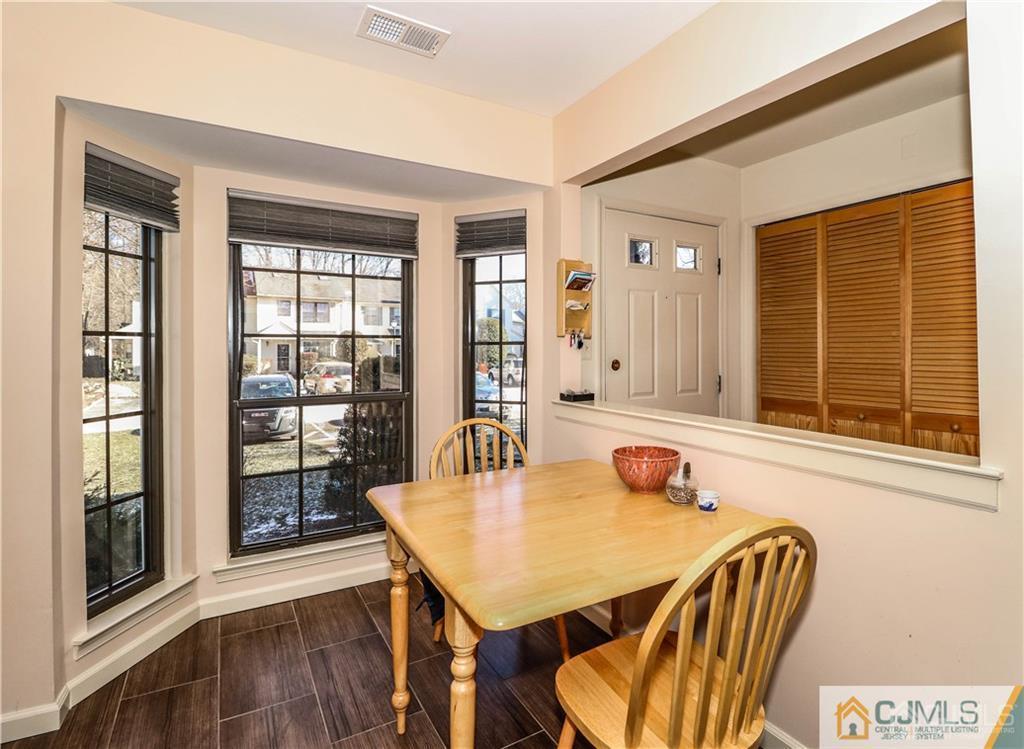306 Maplecrest Road, Unit 306 Edison, NJ 08820 - Photo 10 of 25 a dining room with furniture and window
