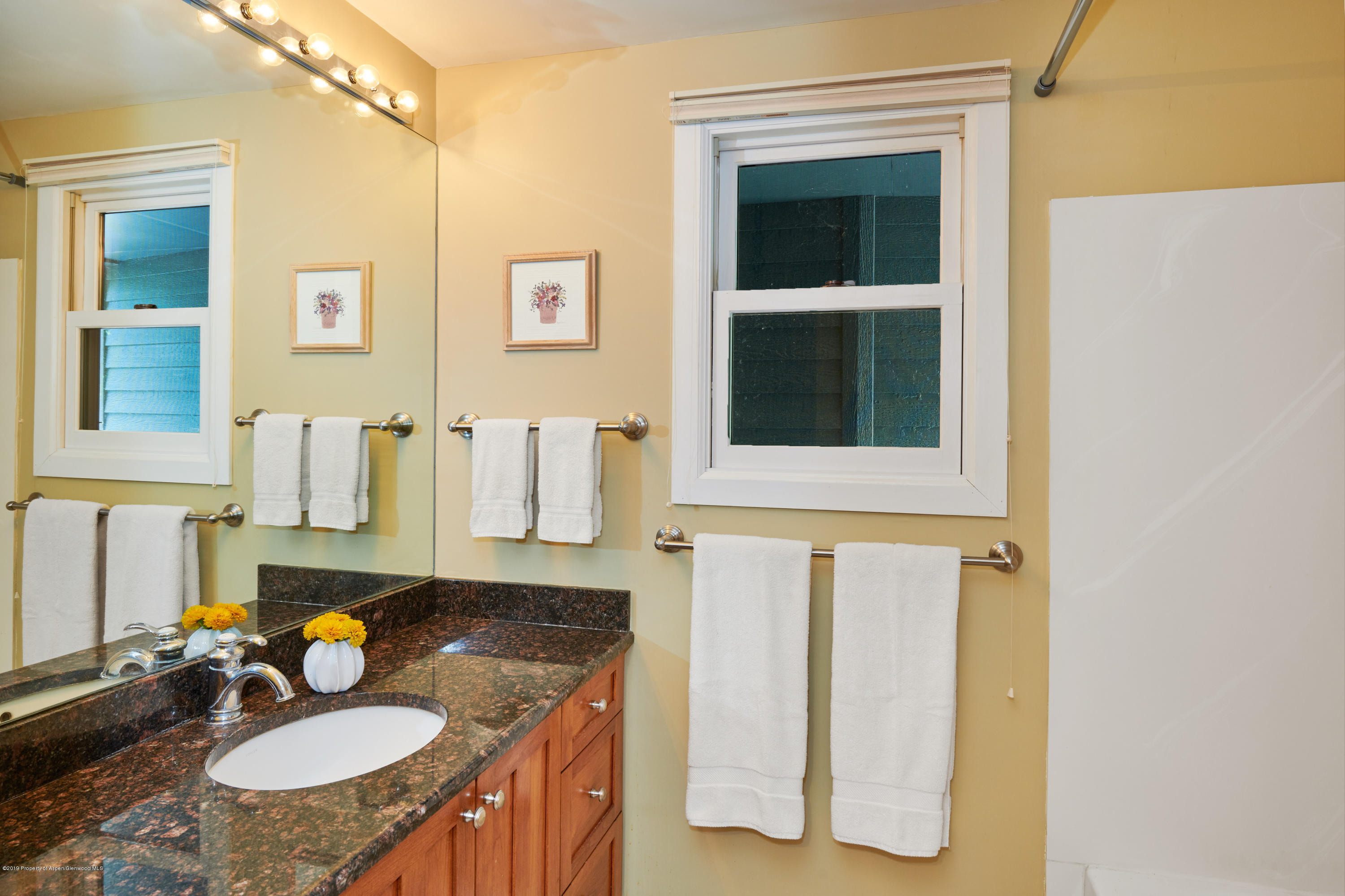 269 Holland Hills Road Basalt, CO 81621 - Photo 11 of 23 a bathroom with a sink toilet and mirror