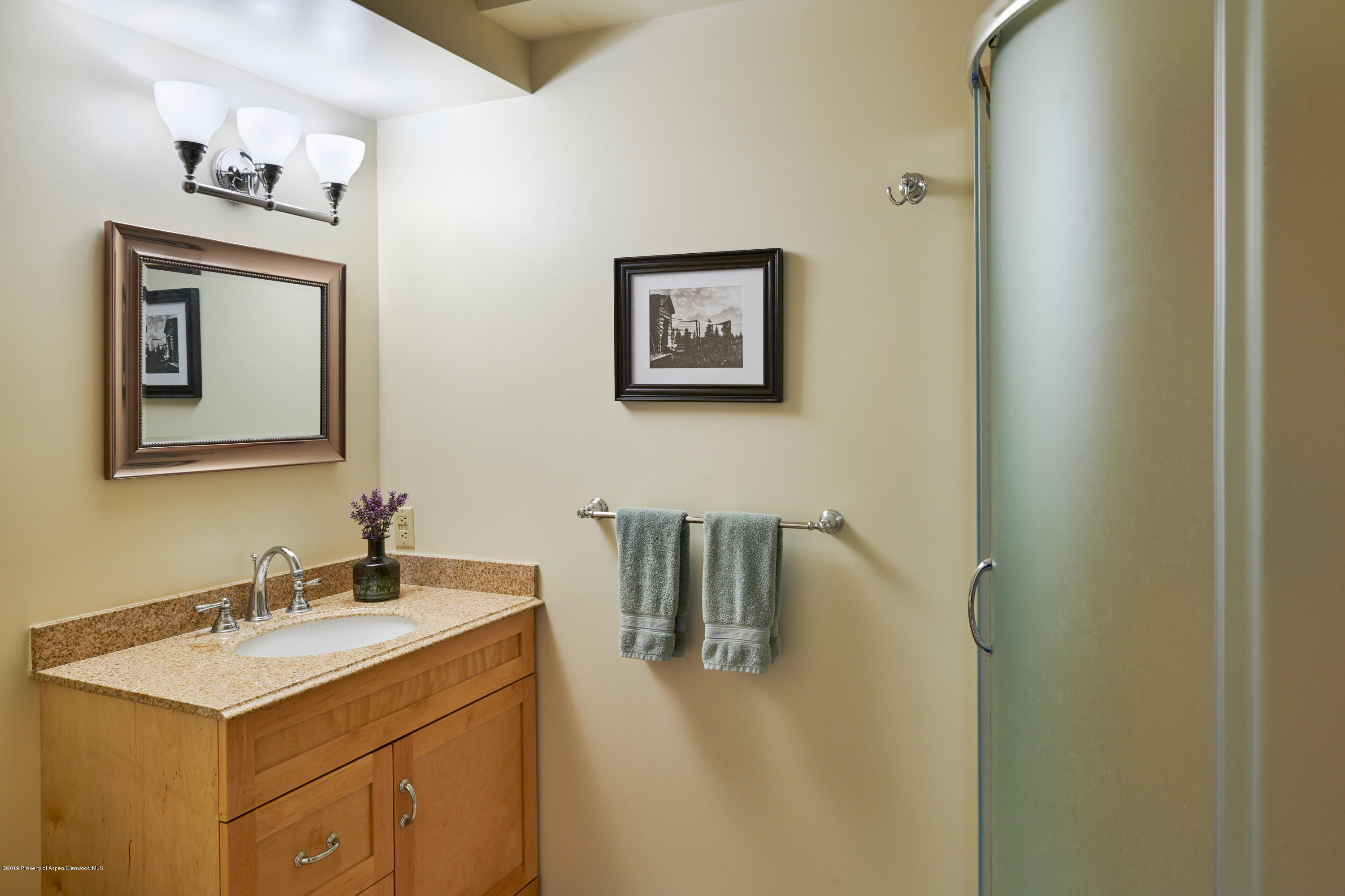 269 Holland Hills Road Basalt, CO 81621 - Photo 13 of 23 a bathroom with a sink vanity and mirror