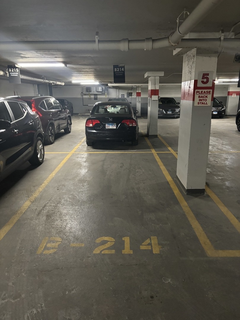 655 West Irving Park Road, Unit B214 Chicago, IL 60613 - Photo 1 of 2 a view of parking garage with cars parked