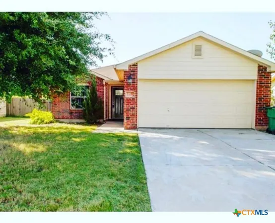 a view of a back yard of the house