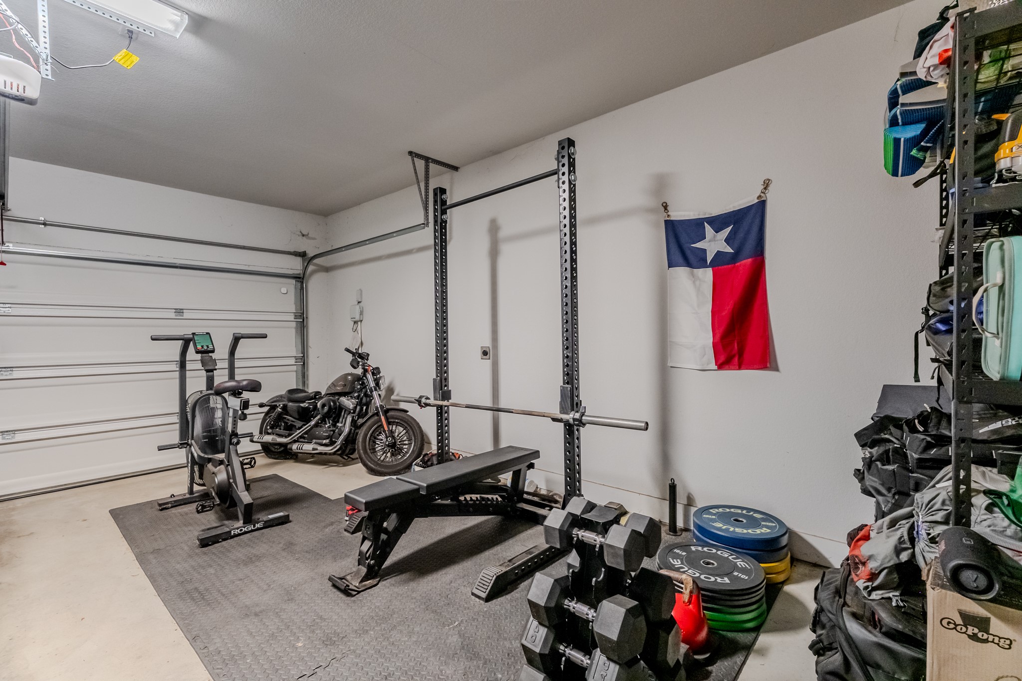 8109 Edmondson Bend Austin, TX 78744 - Photo 38 of 38 A dedicated home gym space, featuring robust workout equipment and ample storage.