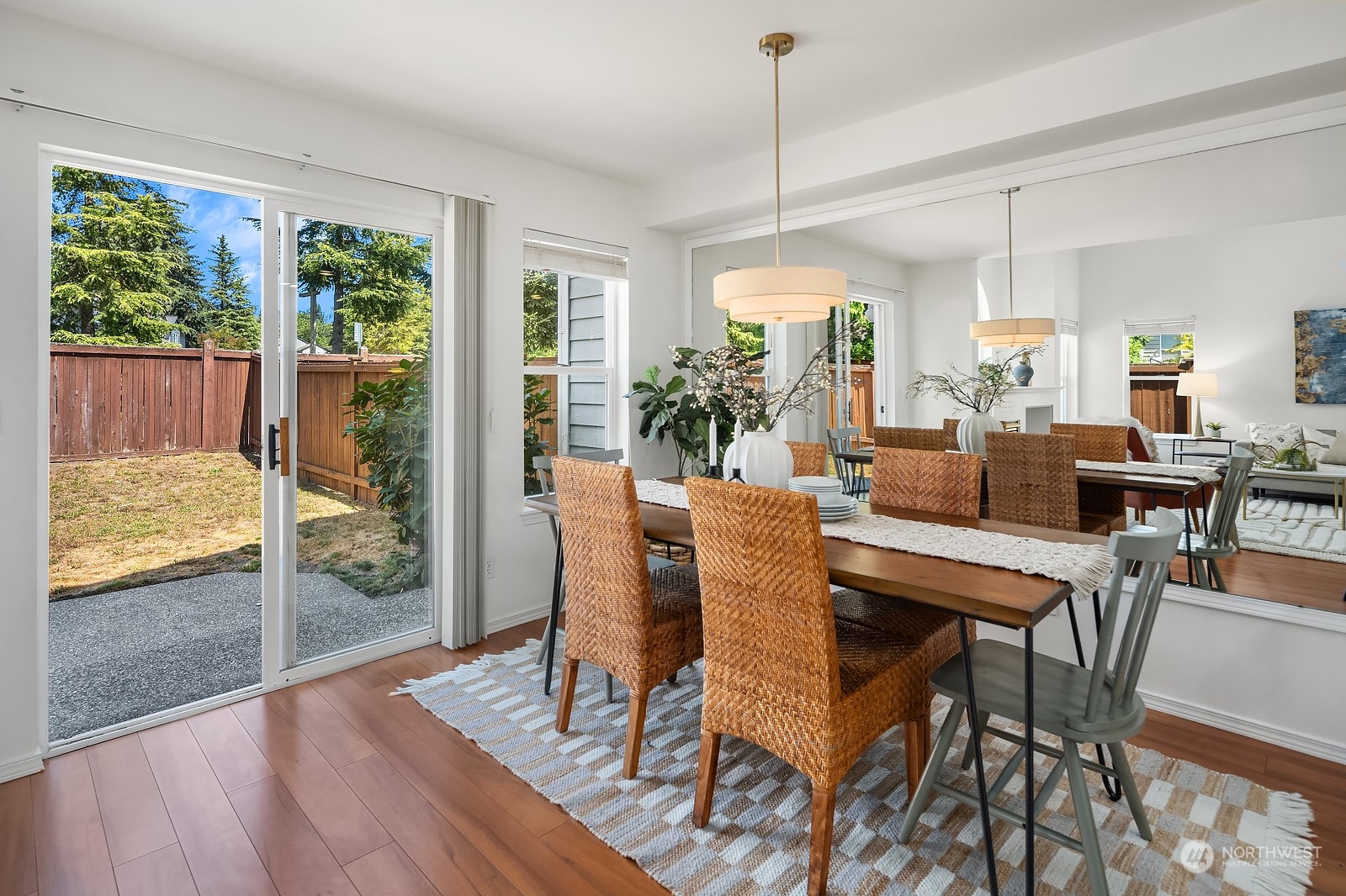 1925 187th Place Southeast Bothell, WA 98012 - Photo 11 of 30 a dining room with furniture a chandelier and wooden floor