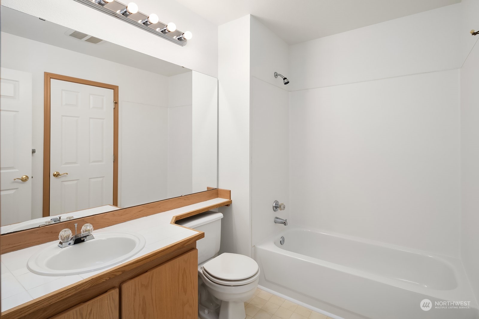 1925 187th Place Southeast Bothell, WA 98012 - Photo 23 of 30 a bathroom with a bathtub shower sink vanity mirror and toilet