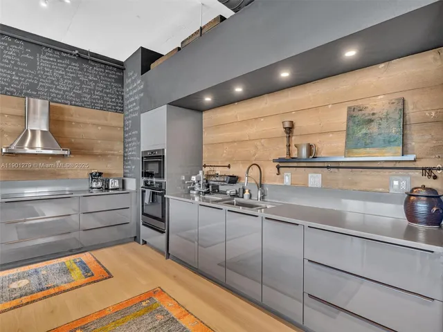 a bedroom with a bed and painting on the wall