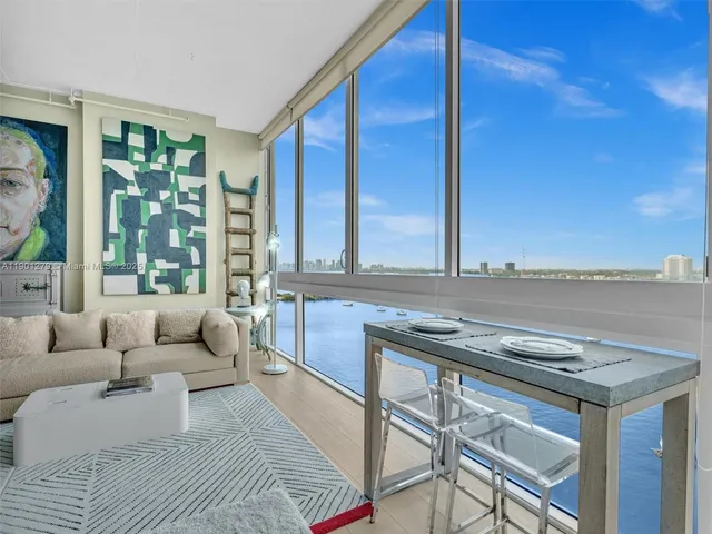 a bedroom with a bed and a chair in it