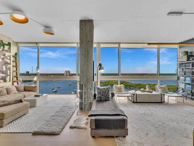 a bedroom with a bed and a table in it