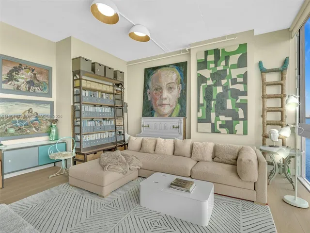 a view of a hallway with workspace and mirror