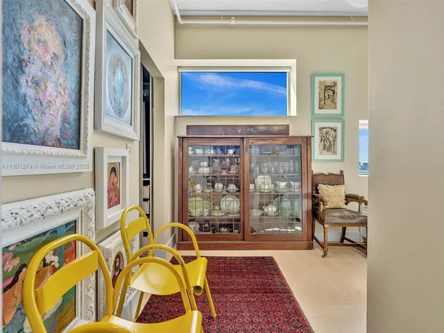 a front view of a house with a tree