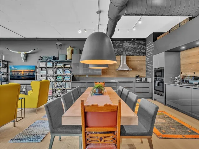 a kitchen with granite countertop stainless steel appliances and counter space