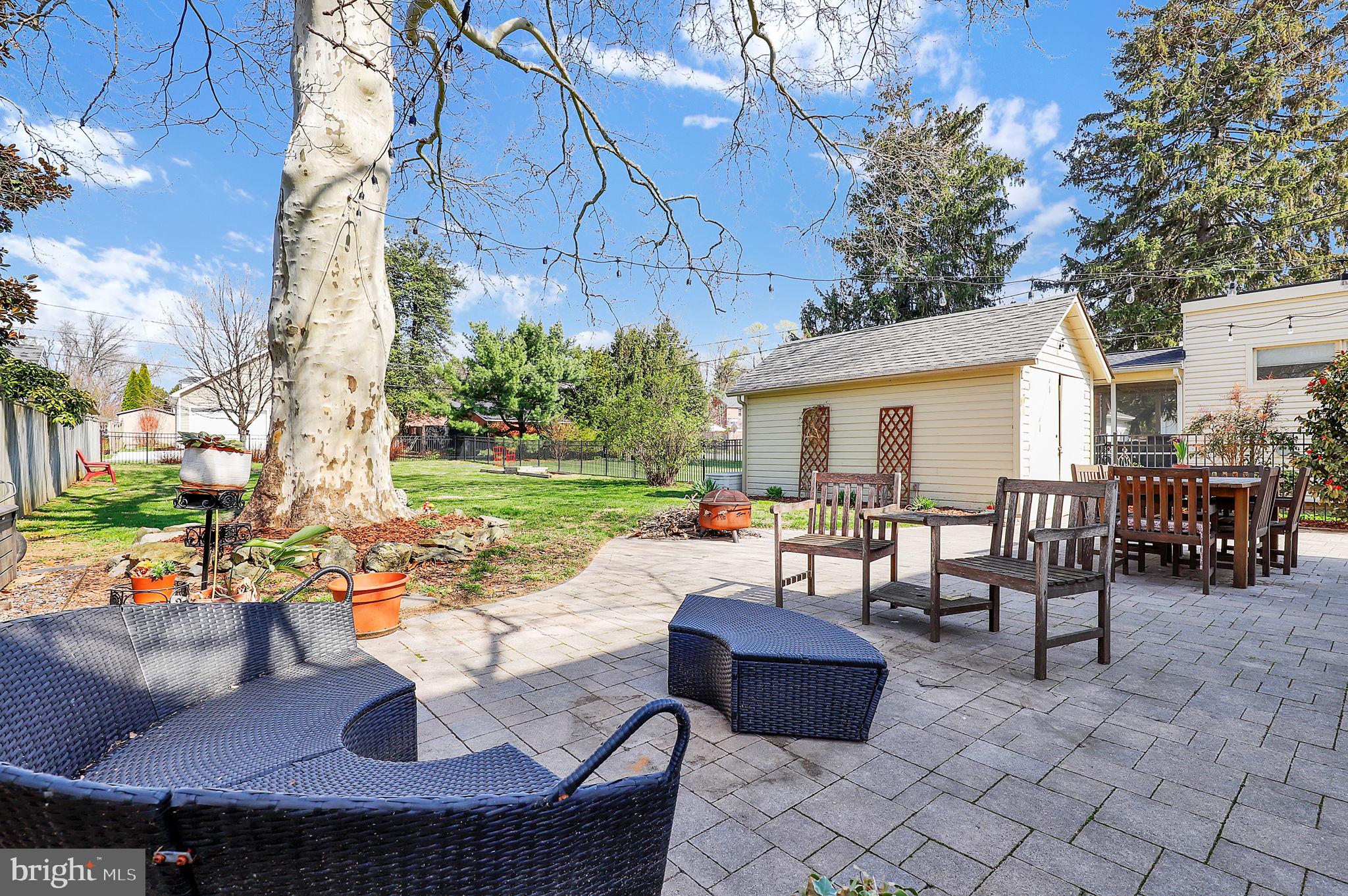 517 Fairview Avenue Frederick, MD 21701 - Photo 29 of 45 a view of a patio with a dining table and chairs with a fire pit and a fire pit