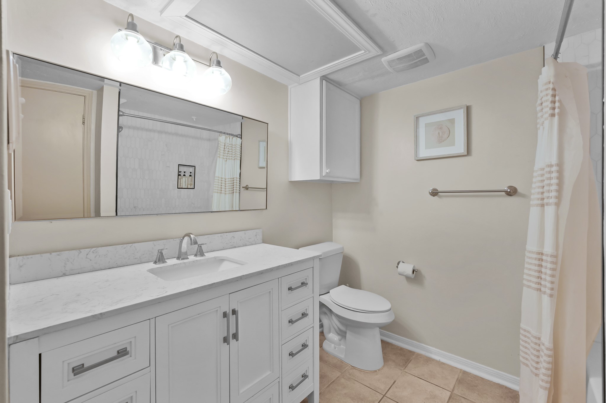 116 April Point Drive North Conroe, TX 77356 - Photo 14 of 44 a bathroom with a toilet sink and mirror