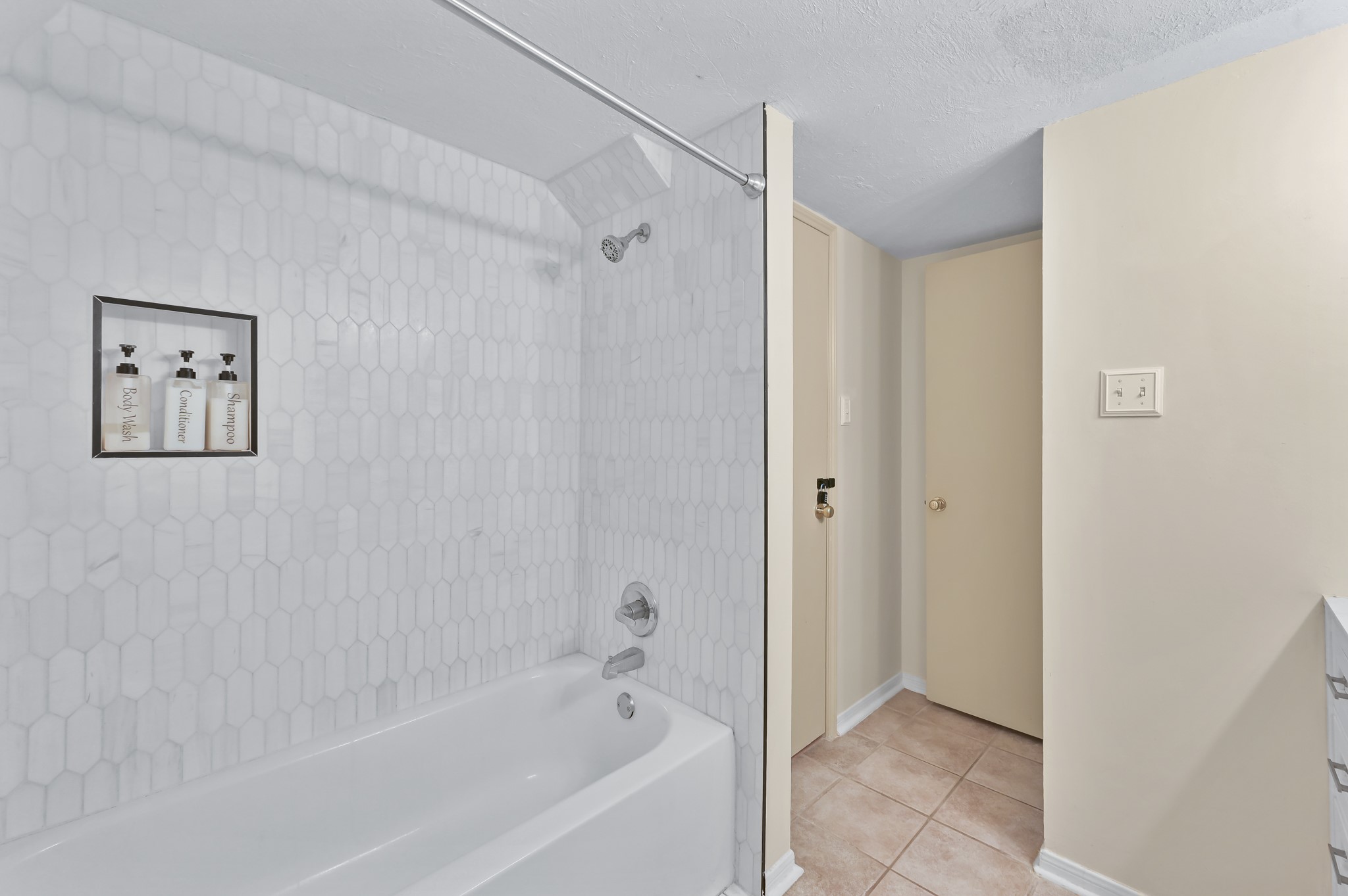 116 April Point Drive North Conroe, TX 77356 - Photo 15 of 44 a bathroom with a bathtub and a shower