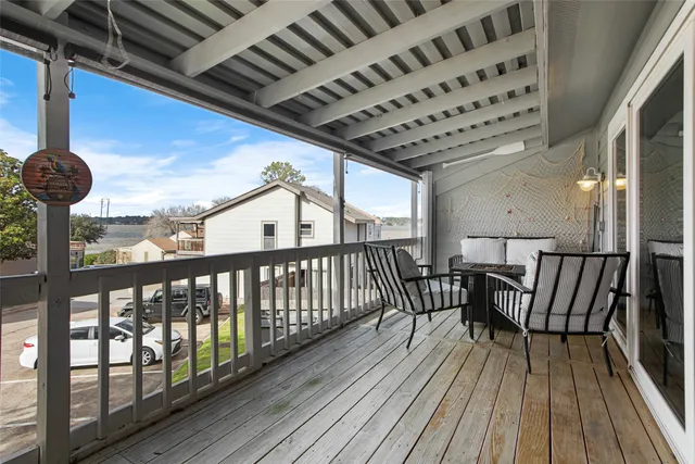 a view of balcony with furniture