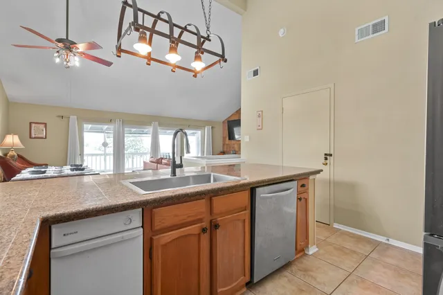 a kitchen with a sink and a refrigerator